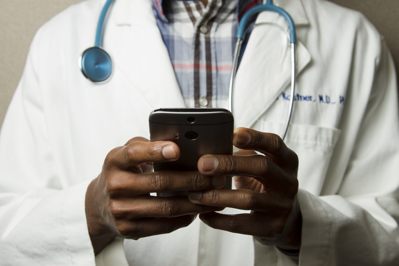 Healthcare professional reviewing medical information on a digital tablet